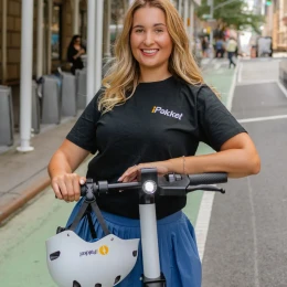 Rider on an iPakket e-scooter in a protected bike lane