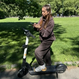 Rider checking the app on a park path